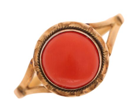 An 18ct gold single stone coral dress ring, rub-over set with round cabochon coral, setting height 10.7mm, size P, 2.4gNo dam