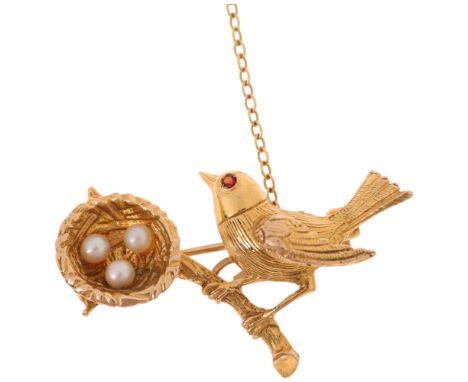 A 9ct gold pearl and garnet 'Bird and Nest' brooch, maker BJ Ltd, London 1969, realistically modelled with garnet eye and pea