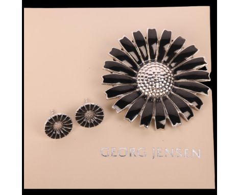 GEORG JENSEN - a Danish modernist sterling silver black enamel daisy pattern matching brooch and stud earring set, brooch 43.