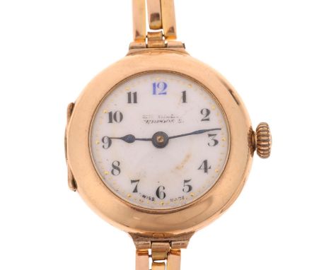 An early 20th century lady's 9ct gold mechanical bracelet watch, white enamel dial with hand painted Arabic numerals, blued s