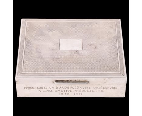 An Elizabeth II silver cigarette box, SJ Rose, London 1970, slimline rectangular form with engine turned lid and sandalwood i