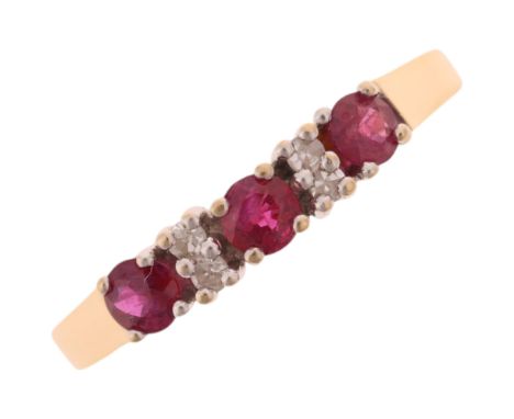 An 18ct gold ruby and diamond half hoop ring, maker DM, import London 1978, setting height 3.7mm, size T, 2.8gAll stones pres