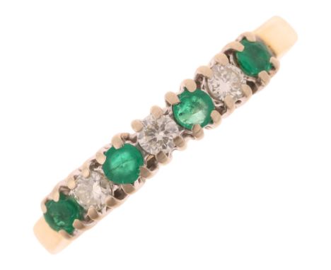 An 18ct gold seven stone emerald and diamond ring, set with round-cut emeralds and modern round brilliant-cut diamonds, setti