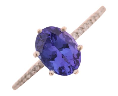An 18ct whit gold single stone tanzanite ring, maker R&G, claw set with oval mixed-cut tanzanite and modern round brilliant-c