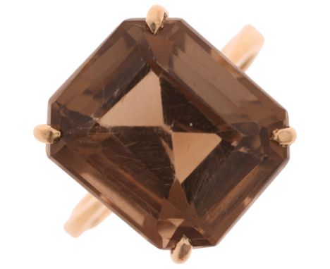 A 9ct gold smoky quartz dress ring, indistinct maker, Birmingham 1998, claw set with octagonal step-cut smoky quartz, setting