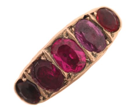An Antique 9ct gold five stone ruby half hoop ring, maker AM, Chester 1908, set with graduated oval mixed-cut rubies, largest