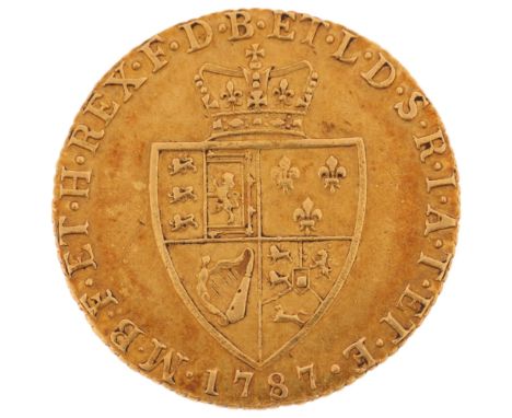 A George III 1787 gold spade guinea coin, 24.4mm, 8.3g Only very light wear to high points, decoration and text still quite c