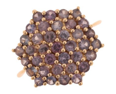 A 9ct gold alexandrite hexagonal cluster ring, maker CR, Birmingham 2014, setting height 17mm, size L, 3.2gNo damage or repai