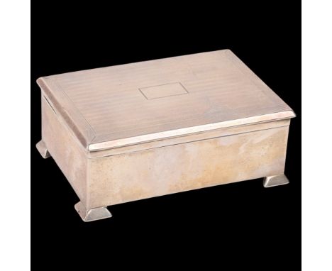 An Arts and Crafts George V silver cigarette box, James Deakin & Sons, Chester 1924, rectangular form with engine turned lid 