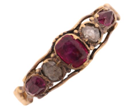 An Antique Georgian five stone ruby and diamond ring, circa 1820, set with oval and pear-cut rubies with Dutch rose-cut diamo