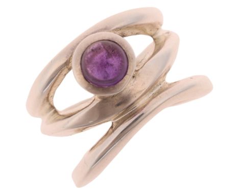 A sterling silver amethyst abstract band ring, set with round cabochon amethyst, setting height 14.6mm, size M, 12.1gNo damag