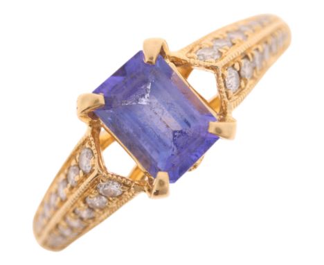 An 18ct gold tanzanite and diamond ring set with octagonal step-cut tanzanite and modern round brilliant-cut diamond shoulder