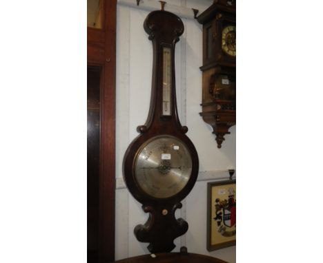 A VICTORIAN WHEEL BAROMETER with silvered dial