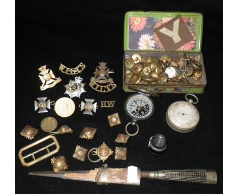 A POCKET BAROMETER, a small quantity of military badges and similar items