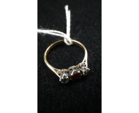 A RUBY AND DIAMOND THREE STONE RING