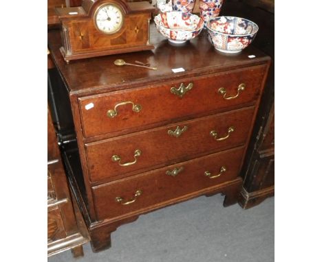 AN 18TH CENTURY OAK CHEST OF THREE DRAWERS of small proportions, on bracket feet, 28" wide