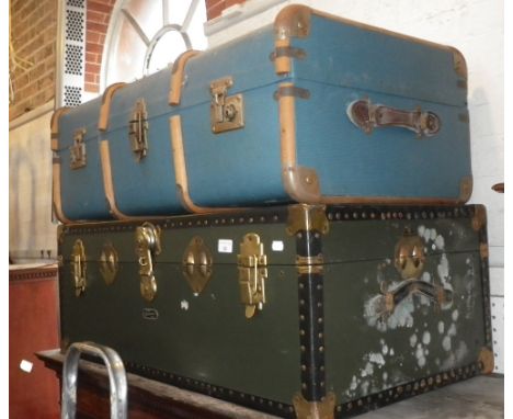 A 1930'S WOODEN BOUND BLUE TRAVELLING TRUNK and another similar trunk