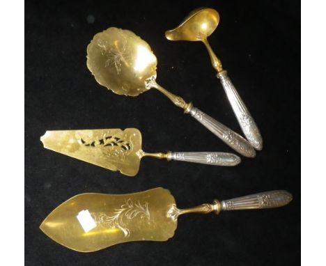 A GILT AND WHITE METAL SERVING SUITE comprising slice, fish scoop and ladle