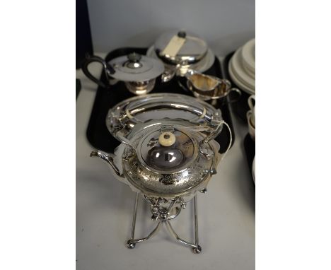 A selection of plated tableware, including: a three-piece tea service; a tureen in Lindisfarne design; a kettle on burner sta