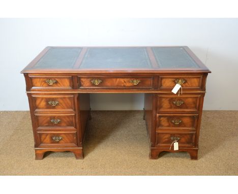 Charles Barr Reproduction Furniture: a Georgian style mahogany pedestal desk, the rectangular top part inset with tooled leat