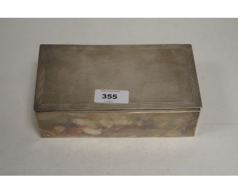 A silver cigarette box, by Adie Brothers Ltd, Chester 1937, with engine turned decoration to lid, opening to reveal wooden in