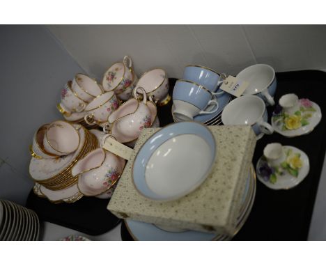 A Tuscan china part tea service, decorated with flowers on pink ground; a Doulton part dinner and tea service; a pair of Crow