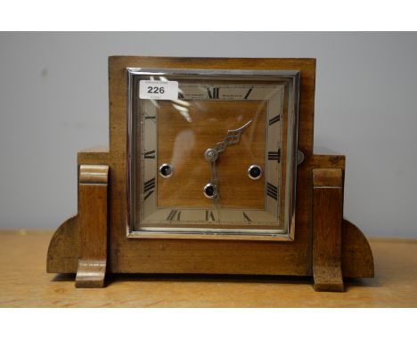 An Art Deco mahogany cased mantel clock, by Northern Goldsmiths, with silvered roman dial fitted movement and Westminster chi