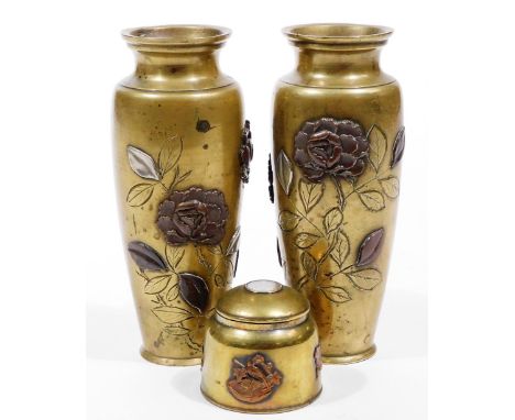 A pair of Japanese bronze baluster vases, late Meiji period, of shouldered form raised with flowerheads raised in a two-colou