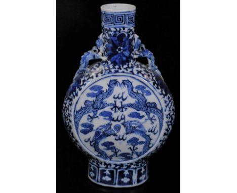 A 19thC Chinese blue and white porcelain moon flask, the circular body with dragon handles on oval foot with an upper Greek k