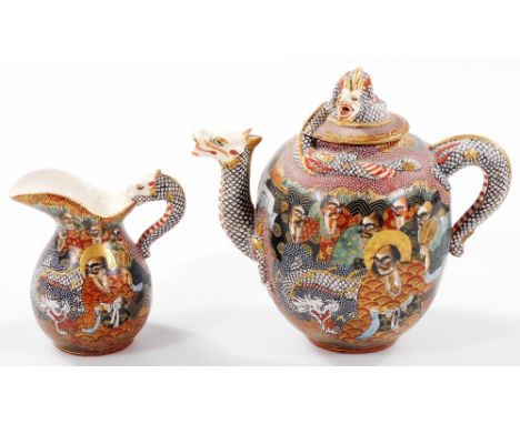 A Japanese Meiji period Satsuma pottery two piece tea service, comprising teapot with domed dragon knop, profusely decorated 