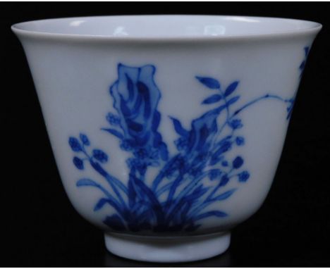 A Chinese porcelain tea bowl, of bell shaped form, profusely decorated with flowers, with seal mark and part script, six char