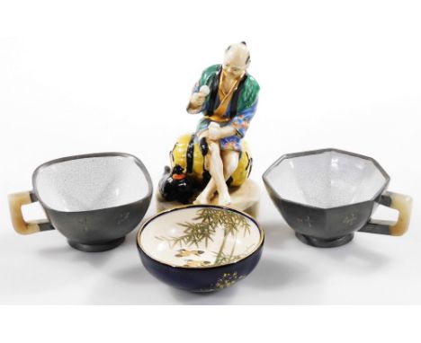 A Japanese late Meiji period pottery Satsuma bowl, of small proportion, handpainted with birds and flowers, with gilt highlig