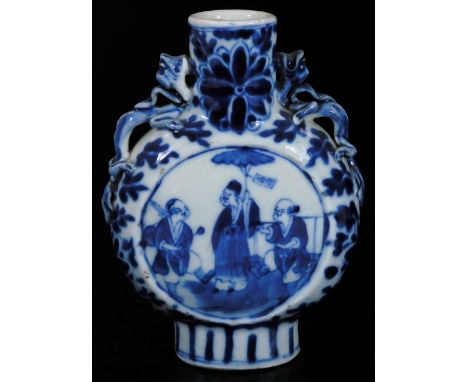 A late 19thC Chinese porcelain moon flask, of small proportion, the circular body with dragon handles on an oval foot, profus