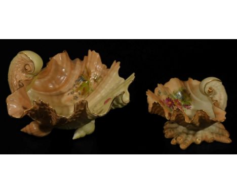 An early 20thC Royal Worcester blush ivory shell shaped dish, 1917, handpainted with posies, on a shaped base, G234, marked b