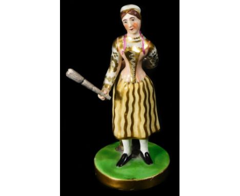 A Chamberlain Worcester figure of Madame Vestry with her broom,  the figure standing on a circular base wearing a yellow grou