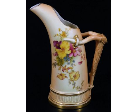 An early 20thC Royal Worcester porcelain blush ivory tusk jug, 1911, with two pierced openings and bark work handle, the main