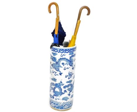 A Chinese pottery stick stand, of circular form profusely decorated with five clawed dragons, late 20thC, 62cm H, various wal