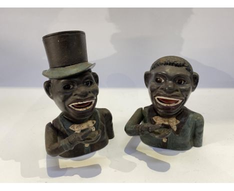 A pair of novelty cast iron painted money banks, the largest measures 20cm H.  This item is listed on the basis it is illustr