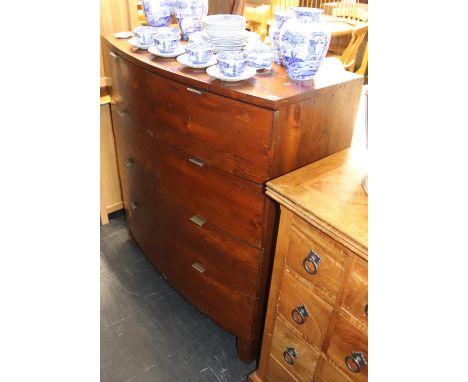 A modern bow front chest of drawers, with six short drawers and one long drawer, 105cm W