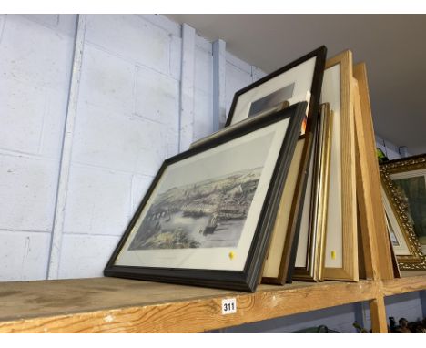 Twelve pictures on a shelf, various subjects