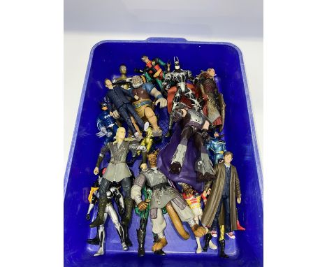 A collection of poseable action figures, including characters from Lord of the Rings, Batman and Robin and Doctor Who