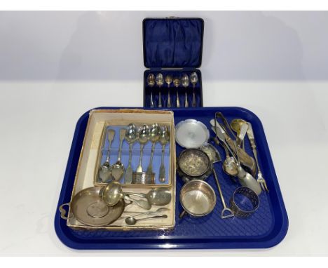 An assorted selection of various silverware and white metal to include caddy and other spoons, napkin rings and trays