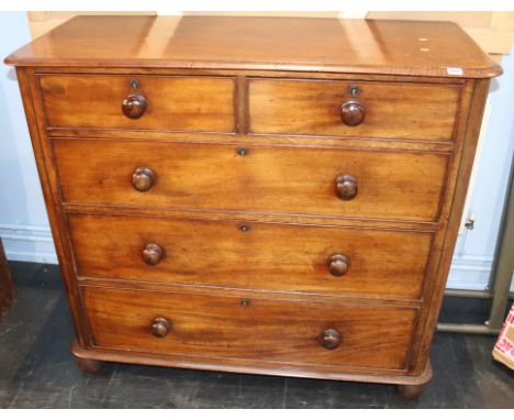 A Victorian mahogany chest of drawers, with two short and three long graduated drawers, all with turned wooden handles, 12cm 