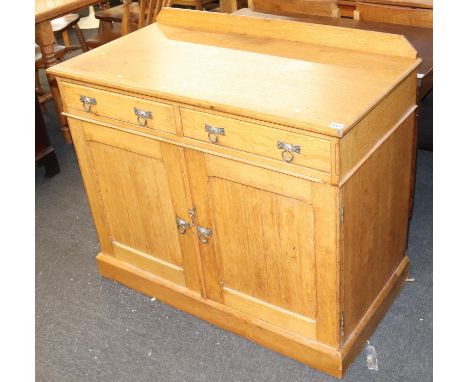 A 1920s aesthetic design light oak side cabinet, with two drawers and panelled doors below, 112cm W