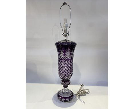 A Bohemian amethyst cut glass table lamp, measuring 93cm H