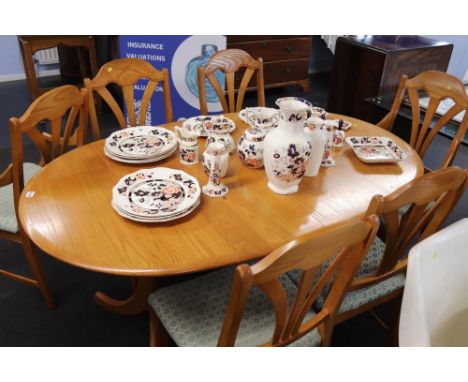 A light oak dining table and six chairs