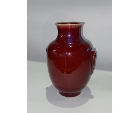An 18th Century Chinese Langyao lantern vase, covered in an oxblood coloured glaze, 31cm H