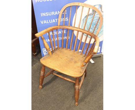 A stick back Windsor chair