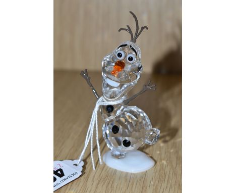 A SWAROVSKI CRYSTAL 'OLAF' FIGURE, from Disney's Frozen, produced 2016-2020, model no 5135880, in clear and orange crystal, h