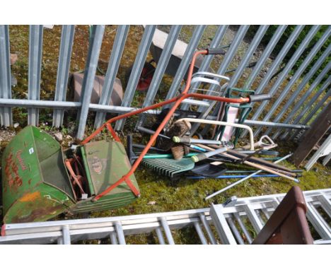 A VINTAGE QUALCAST MANUAL LAWN MOWER and a collection of garden tools